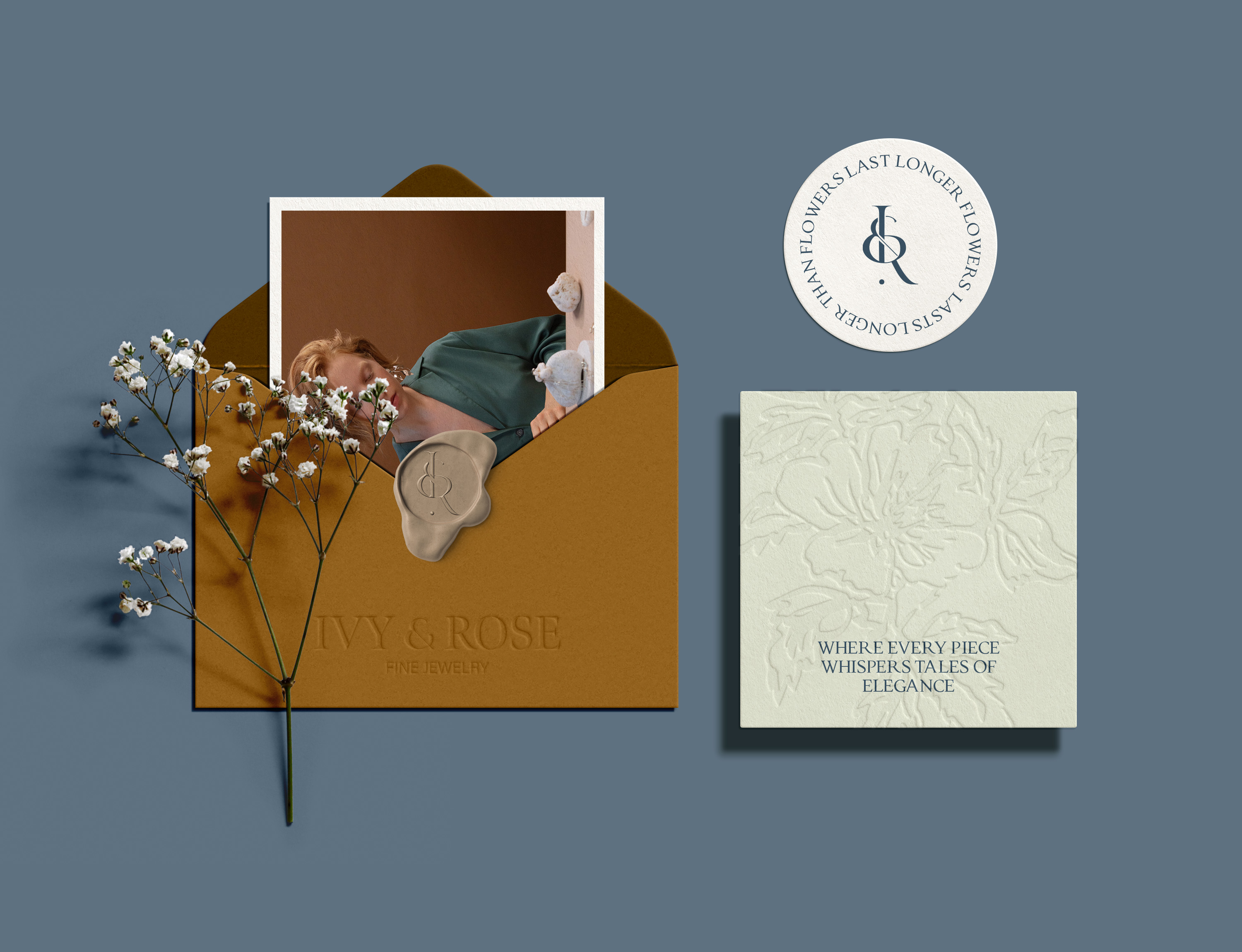 stationary that consist of envelope, sticker and card with a flower
